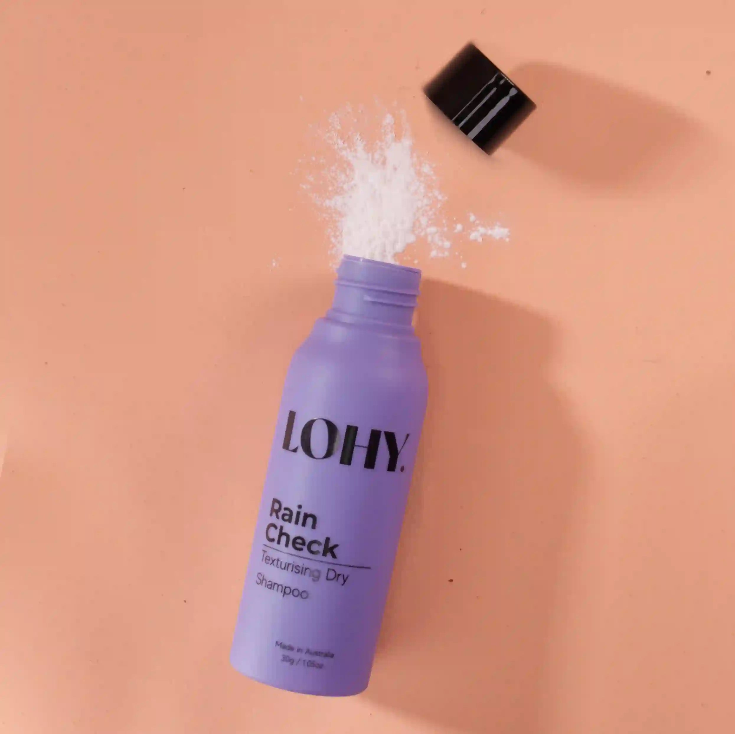 purple hair product bottle, dry shampoo bottle, powder hair shampoo, curly hair dry shampoo