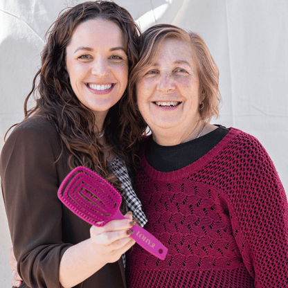 Jonina and her mother pictured with pink LOHY. Paddle Brush
